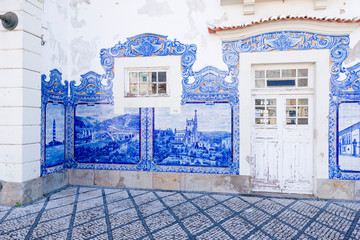 azulejos panels on the facade of the old railways station describing the maritime life of the region in Aveiro, Portugal