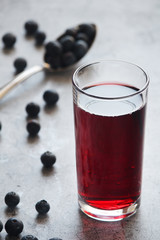A glass with blue berry juice