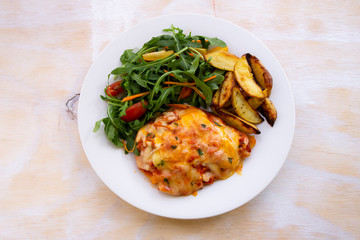 Chicken Parmesan Baked in Tomato Sauce with cheese, chips