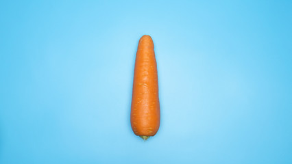 Orange carrots isolated on blue background, Top view Blank for design copy space.