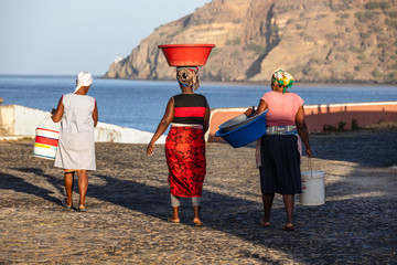 Group of women on their way to the quay in Tarrafel to get the fresh fishing