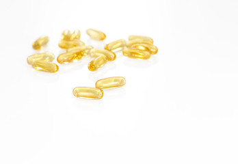 Omega 3 yellow soft gel pills isolated on white background. Copy space