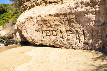 Name of Tarrafel carved in sandstone on the Tarrafel beach, Island Santiago, Cape Verde
