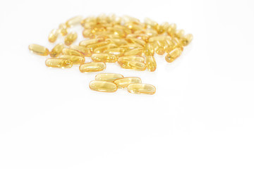 Omega 3 yellow soft gel pills isolated on white background. Copy space