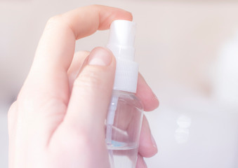 Antiseptic concept: antibacterial spray for hands, close-up
