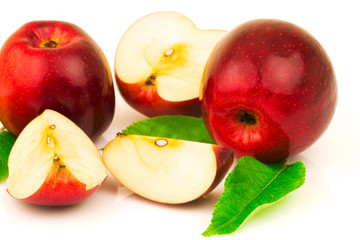 Red apple with green leaves