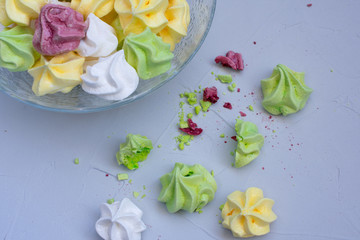 Fototapeta na wymiar colored meringue sweets, marshmallows, cake