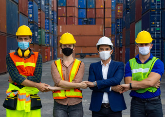 Industrial workers or engineers wearing Coronavirus or COVID-19 protective masks