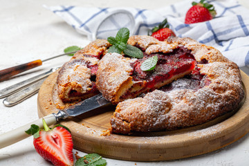 Summer pie with strawberries and basil.