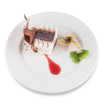 Viennetta frozen cake dessert with kiwi slices.