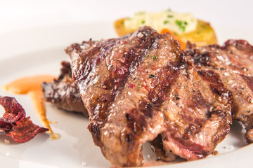 Iberian pork feather loin with baked potato