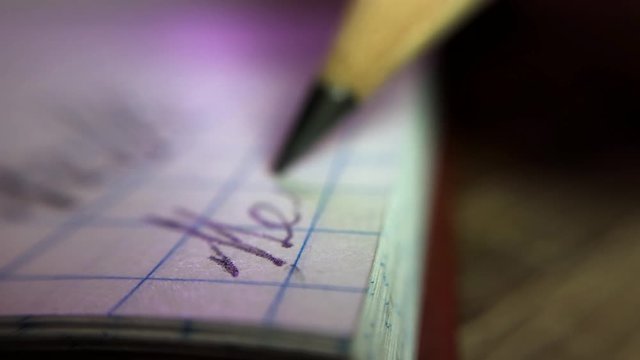 Super macro shot of pencil writing
