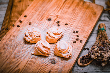 Homemade cake on a rustic wooden table with coffee beans.