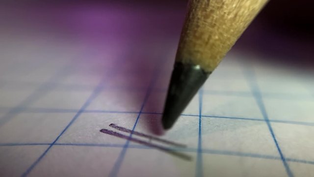 Super macro shot of pencil writing