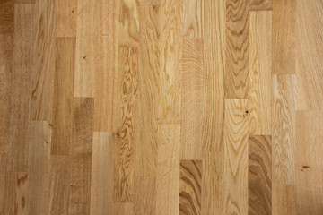 Fototapeta premium Parquet floor with a light brown with sheets and very straight parallel