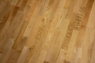 Parquet floor with a light brown textured texture and laid perpendicularly - obrazy, fototapety, plakaty