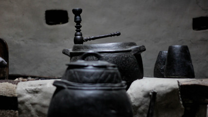 Black cauldron with upside down black cup
