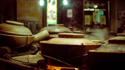 Fototapeta na wymiar Brown pot with a lid and burning pot