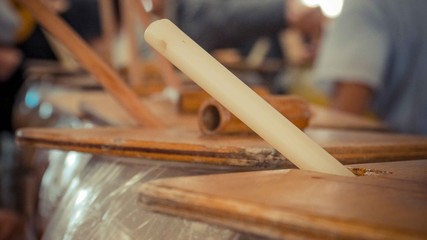 Fototapeta na wymiar Brown wooden stick inside a pot with wooden plank