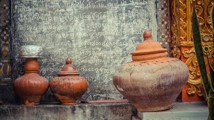 Rows of brown ceramic pot on the floor