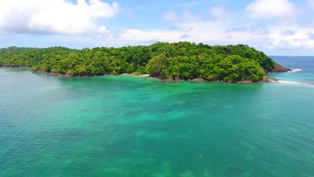 Forward to Strafe Flying Aerial View of Cavada Island (Isla Secas) Water Edge with Clear Torquise Colored Water, White Sand Beach Coves and Rock Cliff Shore