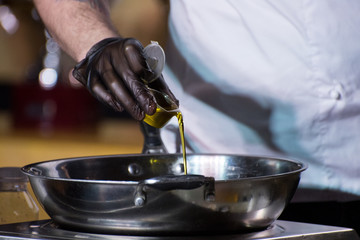 Cooking a salad, a salad of fresh vegetables with olive oil.