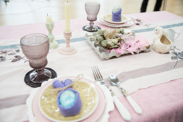 Fototapeta na wymiar Beautiful festive Easter table setting with napkin