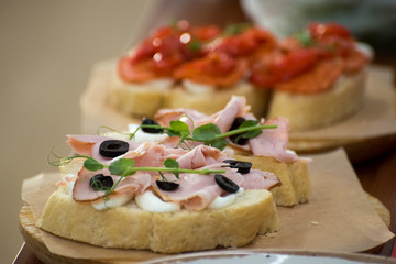 Chef preparing caprese bruschetta in the kitchen