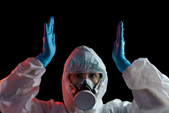 Woman In Hazmat Suit With Empty Between Two Hands