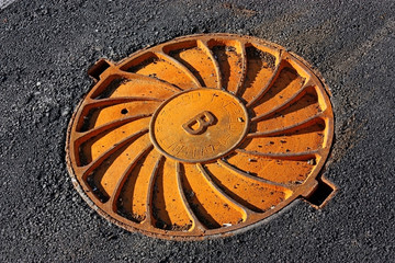 rusty manhole cover