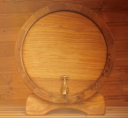 wooden oaken barrel for cellar on a ginger wood backgroung , beer kask with copyspace close up , vine vat of oak