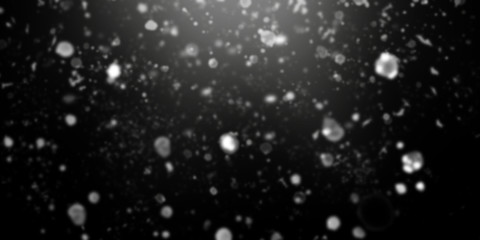 Obraz premium Black blurred background with falling white snow effect and diverging light rays . Horizontal banner