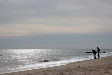 Two kids at the quiet beach