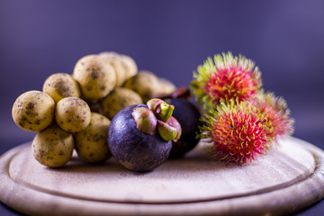Ripe rambutans in the black background, Fresh rambutan with dark background.