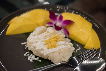 Mango sticky rice served on plate