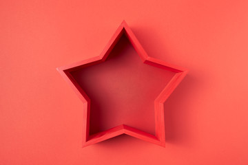 Red hollow star on a red background