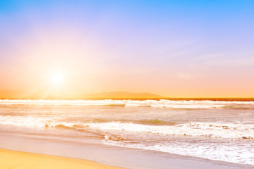 Pacific ocean waves at sunset