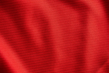 Red sports clothing fabric football jersey texture close up