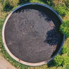 Vertical view down to a large circular tank for the storage of liquid manure