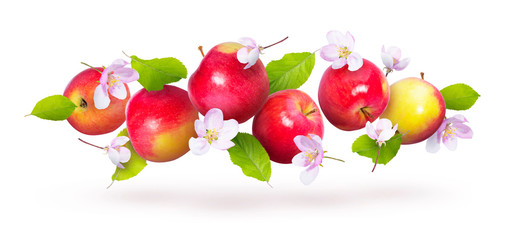 Red apples with green leaves and flowers fly on a white background. Background with apples. Natural fresh product