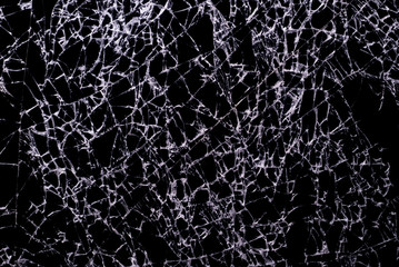 close up textures of broken black glass, with white lines on black glass, macro mode.
