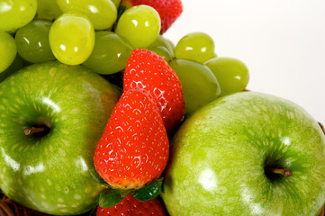 variety of apples with grapes and strawberries. White background. close view. top view. isolated

