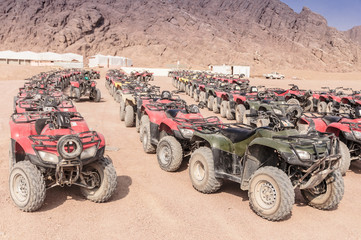 Riding a quad bike in the desert near the Sinai Mountains. Sharm El Sheikh. Photo on a sunny day..Holidays in 2018.