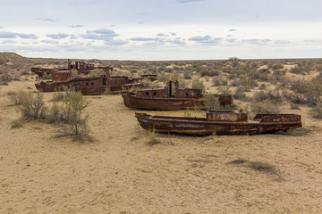 Rusty ships at the ship graveyard in former Aral sea  port town Moynaq (Mo‘ynoq or Muynak), Uzbekistan