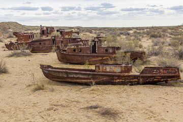 Rusty ships at the ship graveyard in former Aral sea port town Moynaq (Mo‘ynoq or Muynak),...