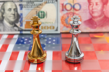 Chess pieces on USA and China national flag with banknote background