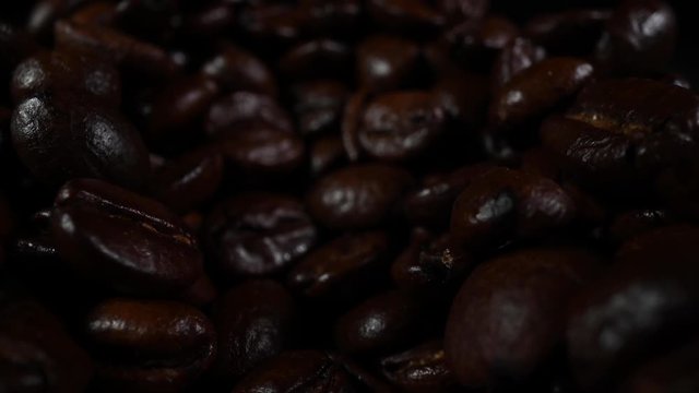 Pull Out Over Roasted Coffee Beans Scattered Across Surface