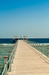 Fototapeta na wymiar Pier at the hotel .Sharm El Sheikh. Photo on a sunny day. Mountains and the sea..Holidays in 2018.