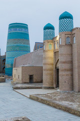 Kalta Minor minaret and Kuhna Ark fort in Khiva, Uzbekistan