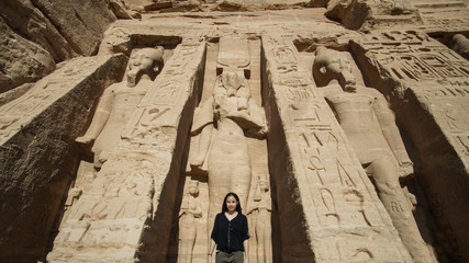 Happy Asian tourist woman travel to Egypt Abu Simbel internation historic handmark